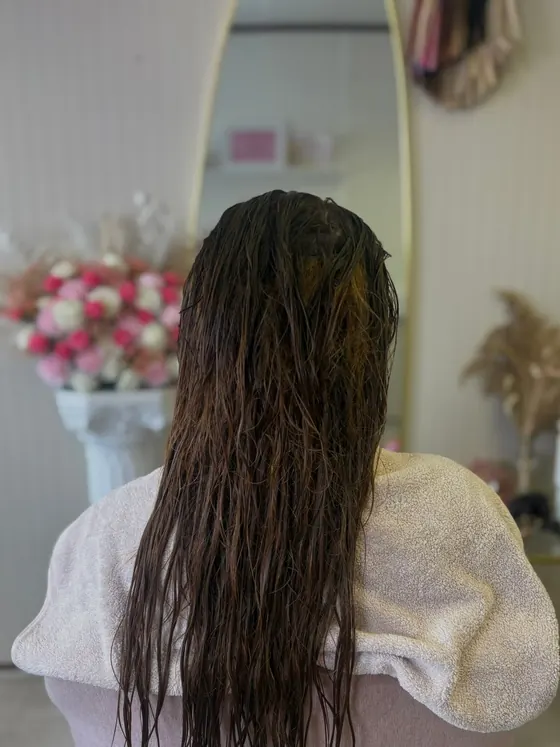 Long hair freshly washed and left damp, ready for styling