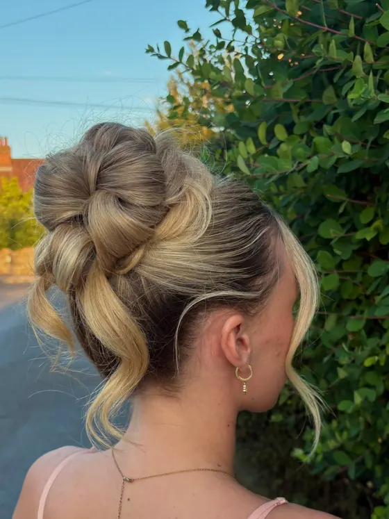 High textured bun photographed outdoors against greenery
