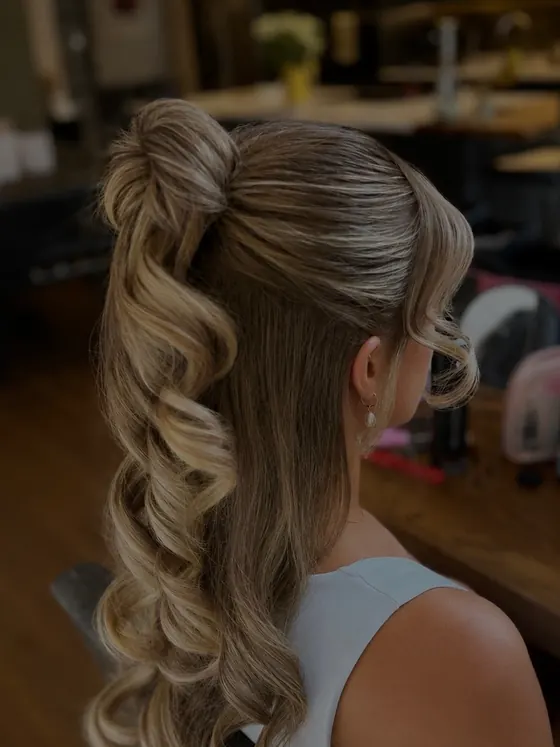 Half up half down style with long curls falling past the shoulder