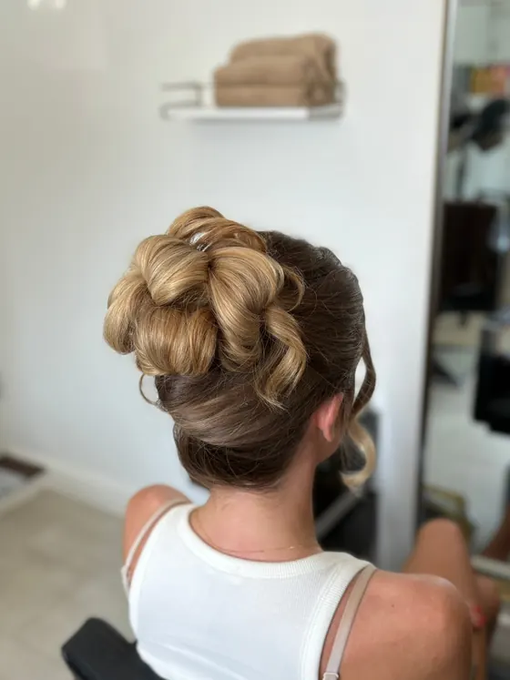 French twist with a rolled and pinned finish, seen from behind